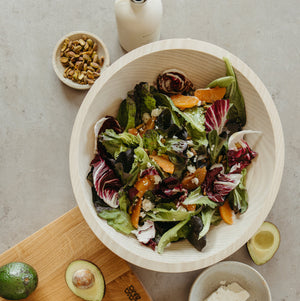 salad in bowl next to cutting board - Number 5