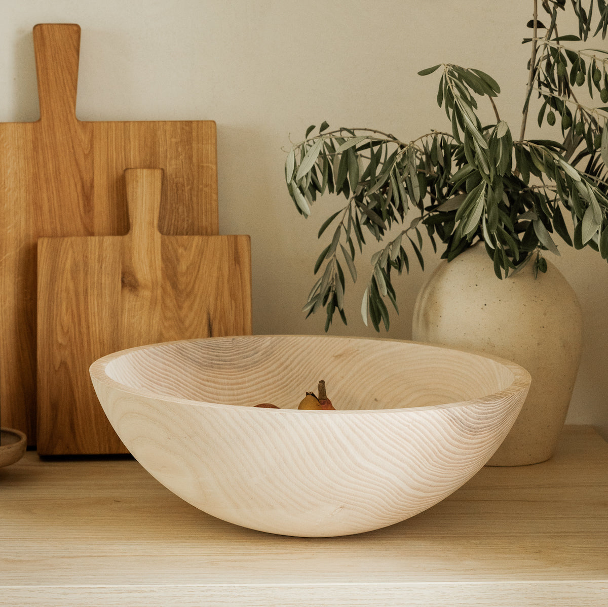 bowl on counter next to plant and cutting boards- Number 2