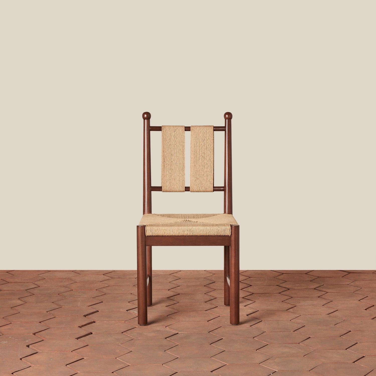 Wooden chair with woven backrest on a wooden floor and beige wall- Number 5