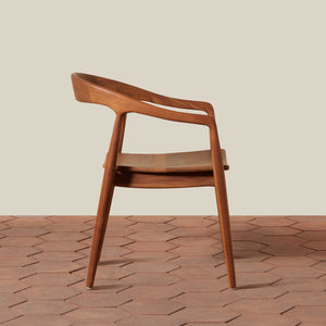 Wooden chair on a textured wooden floor with a neutral background - Number 4