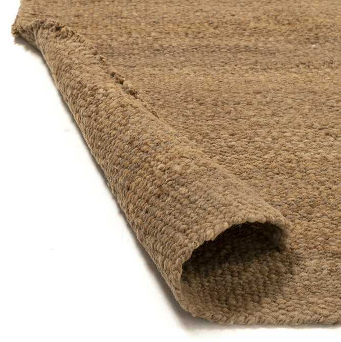 Close-up of a brown textured rug with white stripes on a white background- Number 5