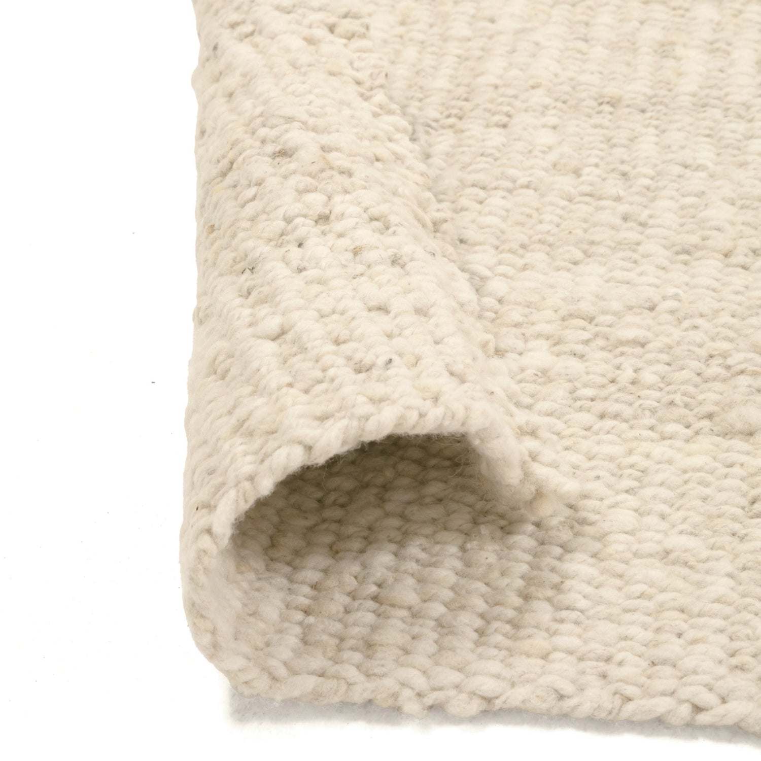 Close-up of a textured beige rug corner on a white background- Number 3