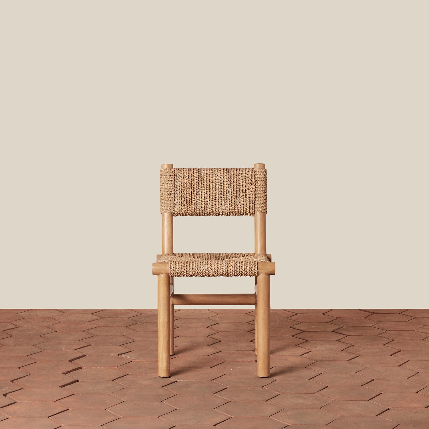 Wooden chair with woven seat and backrest on a wooden floor and beige wall background- Number 6
