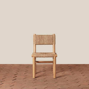 Wooden chair with woven seat and backrest on a wooden floor and beige wall background - Number 6
