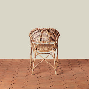 beige woven chair on tile floor with neutral background - Number 8