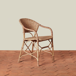 beige woven chair on tile floor with neutral background - Number 1