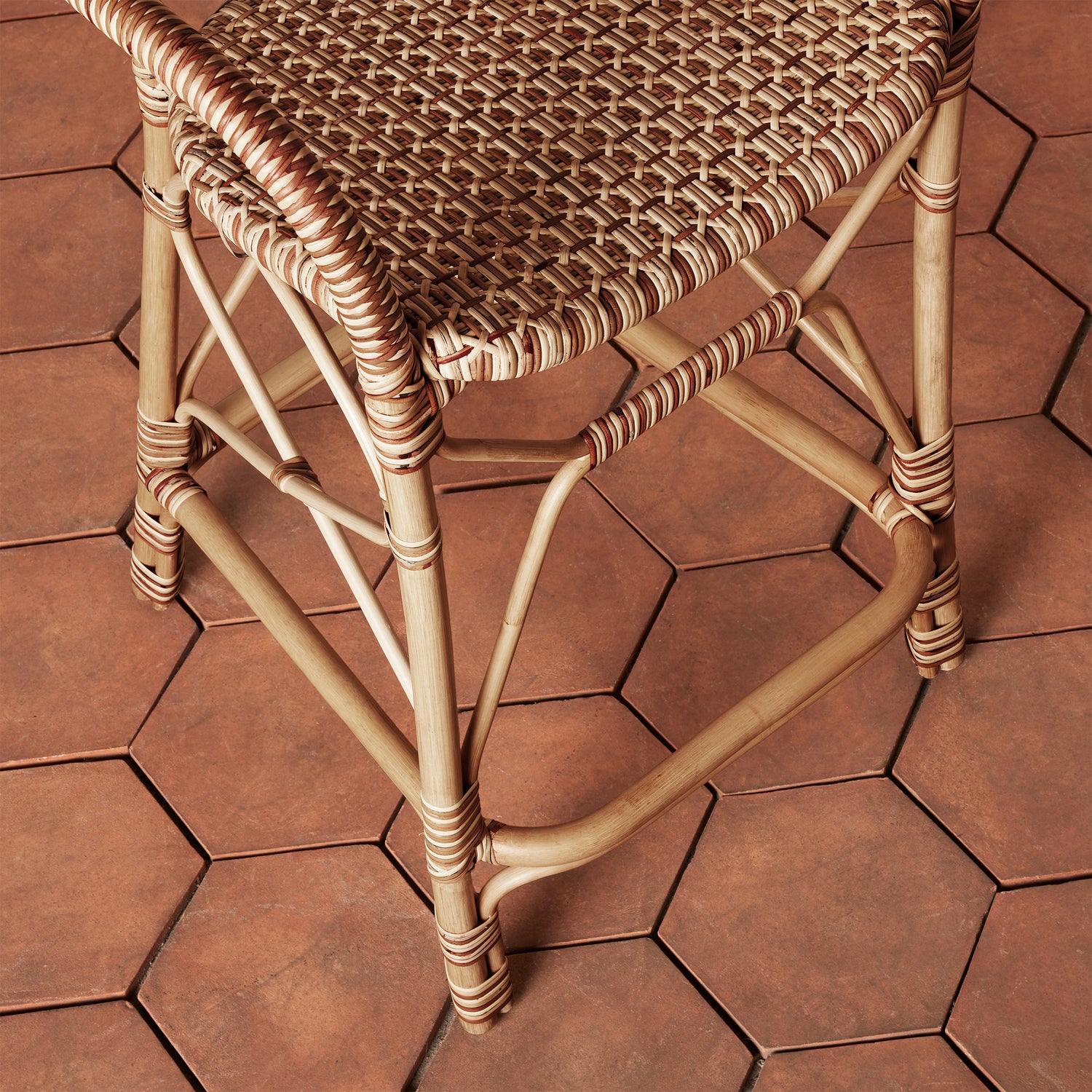 close up of woven chair legs on tile floor- Number 6