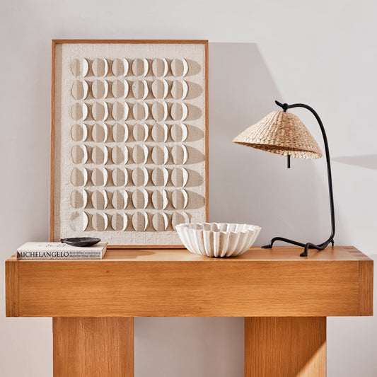 Wooden console table with decorative items against a light wall - Image 2