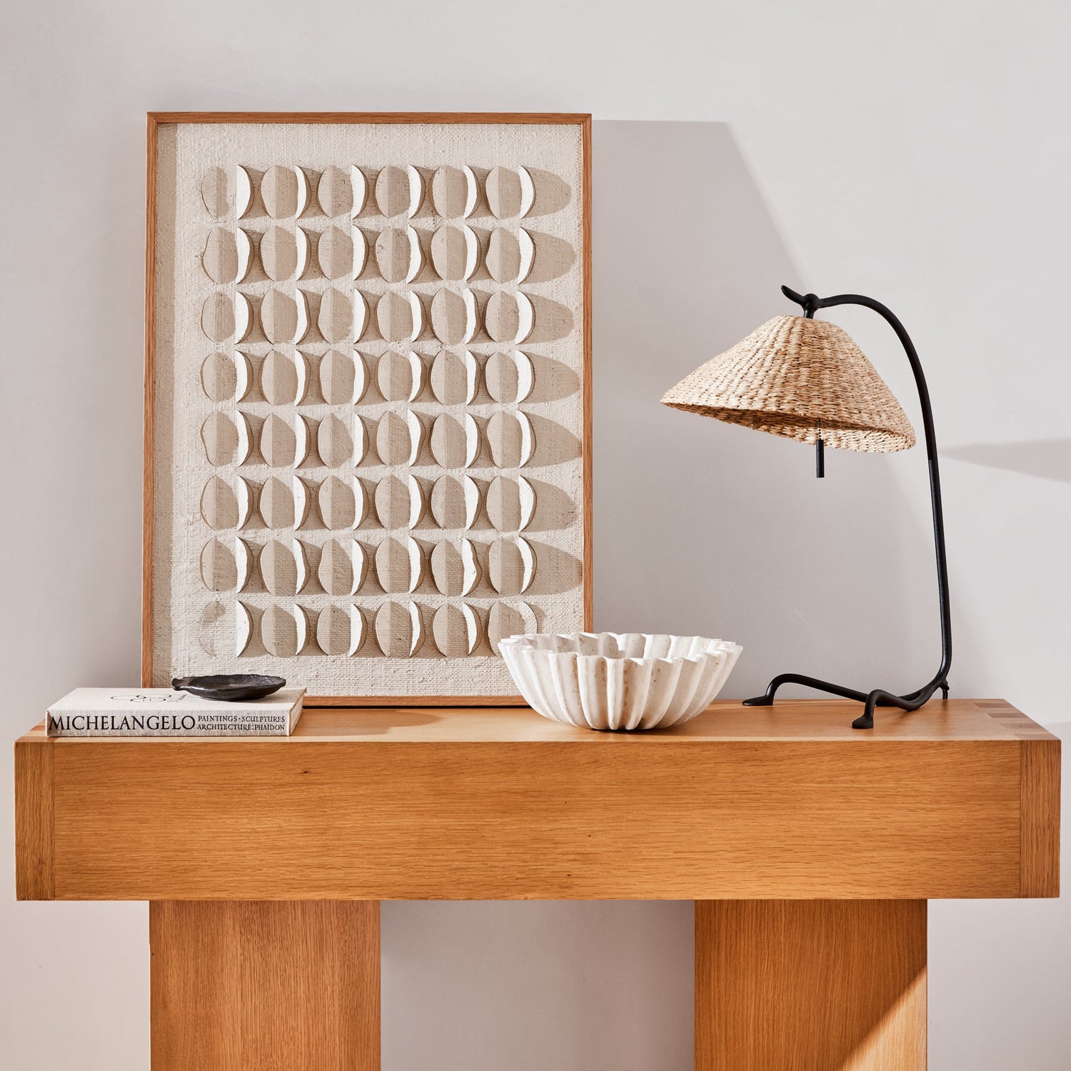 Wooden console table with decorative items against a light wall- Number 2