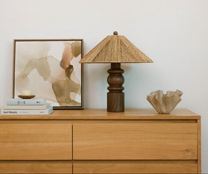 table lamp on dresser next to books - Number 3