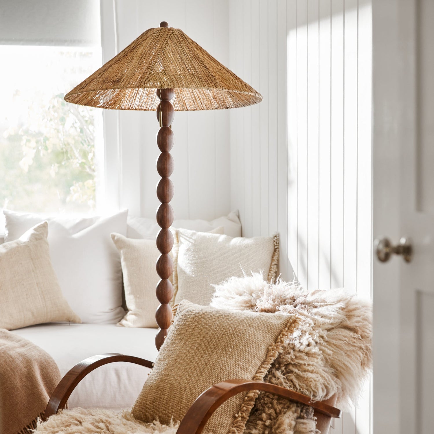 jute and wood lamp next to arm chair and white couch- Number 2