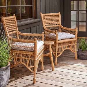 two wicker chairs on deck against dark window - Number 2
