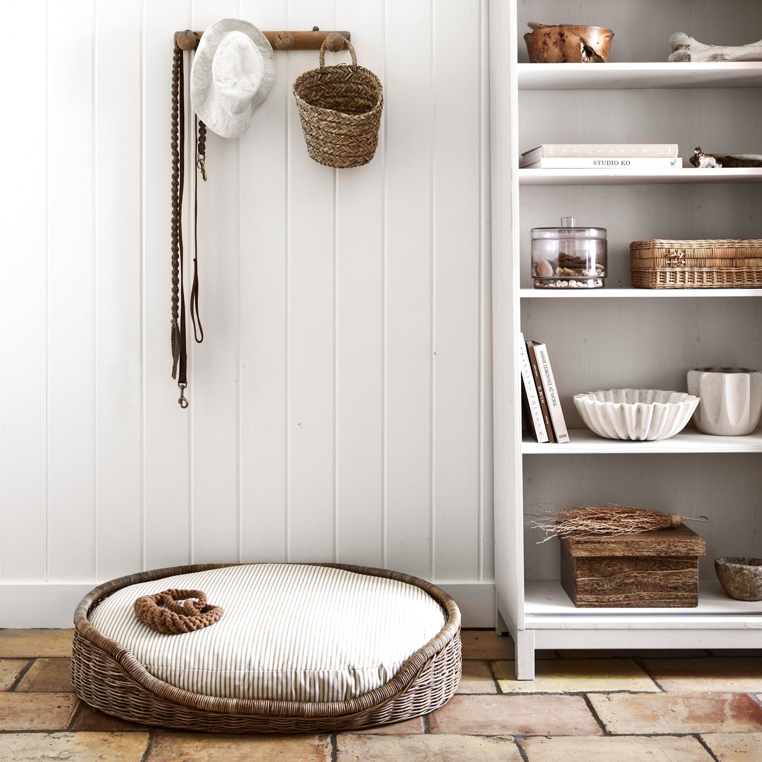 dog bed next to white shelves- Number 3
