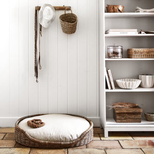 dog bed next to white shelves - Number 3