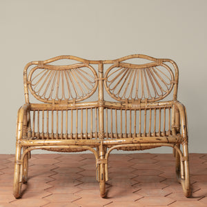 front facing angle of vintage rattan loveseat on tiled floor - Number 2