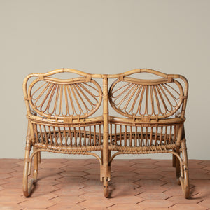 back of vintage rattan loveseat on tiles floor - Number 5