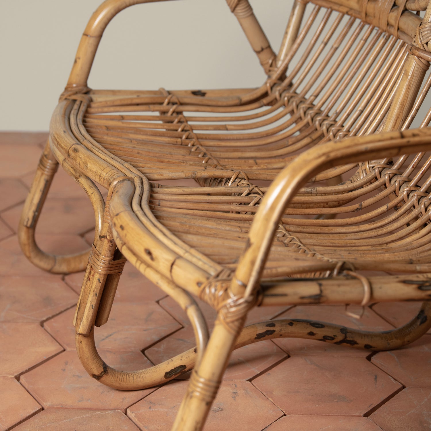 closeup of arm rest of vintage rattan loveseat- Number 4