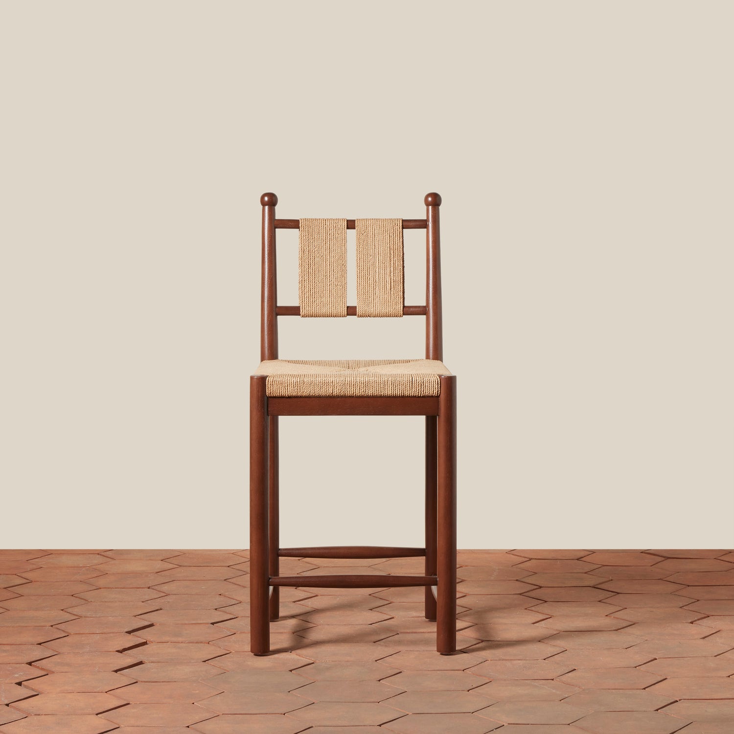 Wooden chair with woven backrest and seat on a wooden floor.- Number 3