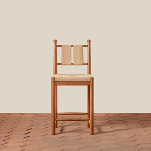 Wooden chair with woven backrest on a wooden floor and beige wall - Number 9