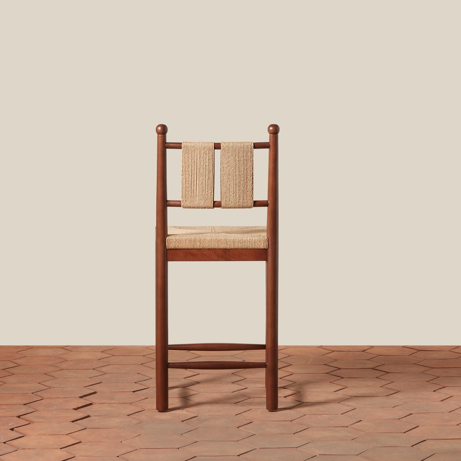 Wooden chair with woven backrest on a wooden floor and beige wall- Number 4