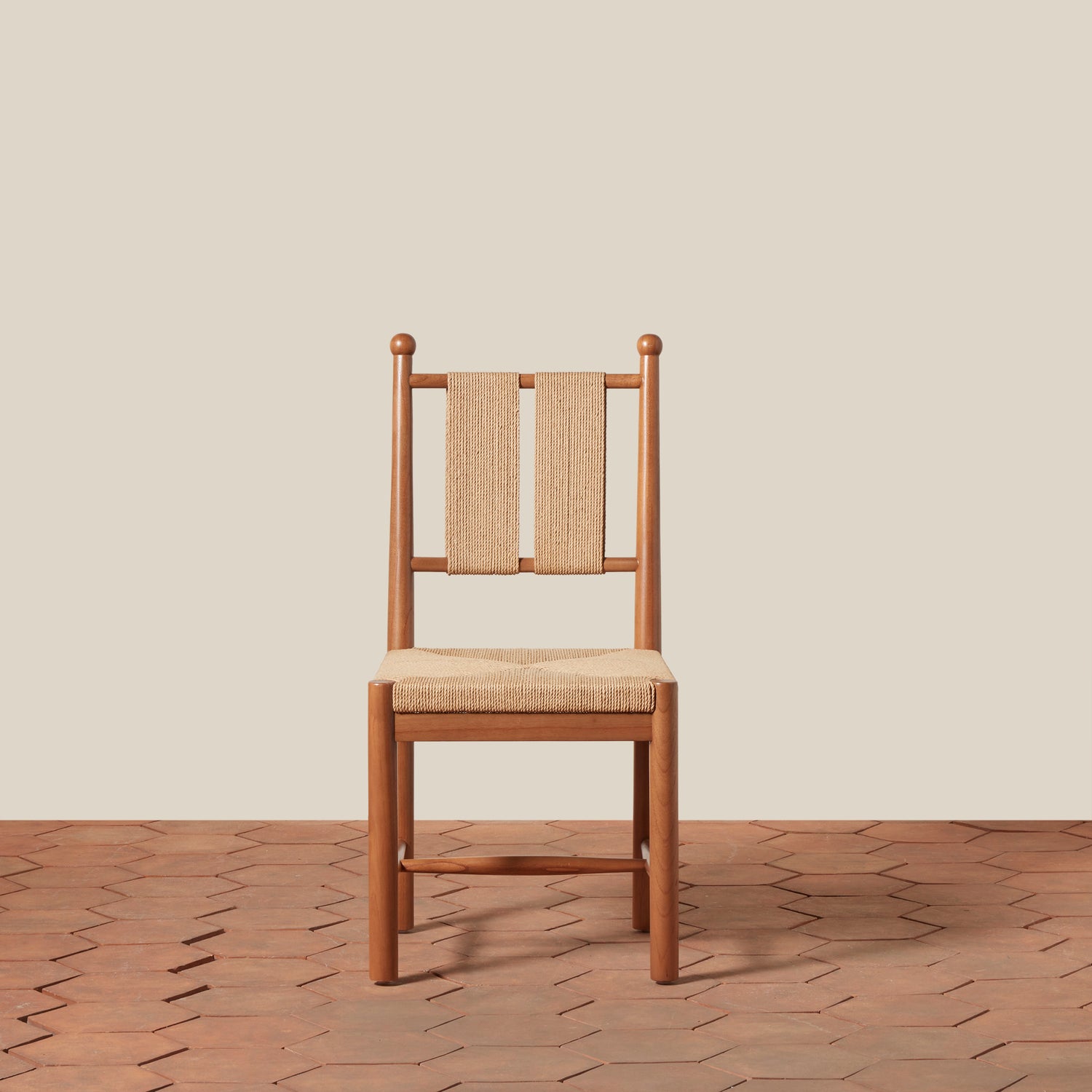 Wooden chair with woven backrest on a wooden floor and beige wall- Number 11