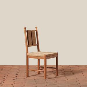 Wooden chair with woven backrest on a wooden floor and beige wall - Number 9