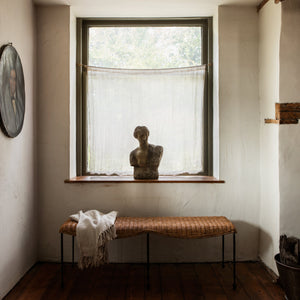 Room interior with a bench, window, and sculpture. - Number 3