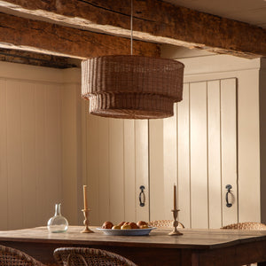 Dining area with wooden table and chairs, wicker pendant light, and neutral walls. - Number 2