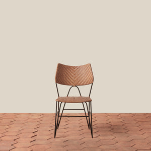 Woven chair with metal legs on a wooden floor and beige wall - Number 3