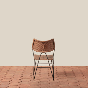 Woven chair with metal legs on a wooden floor and beige wall - Number 4