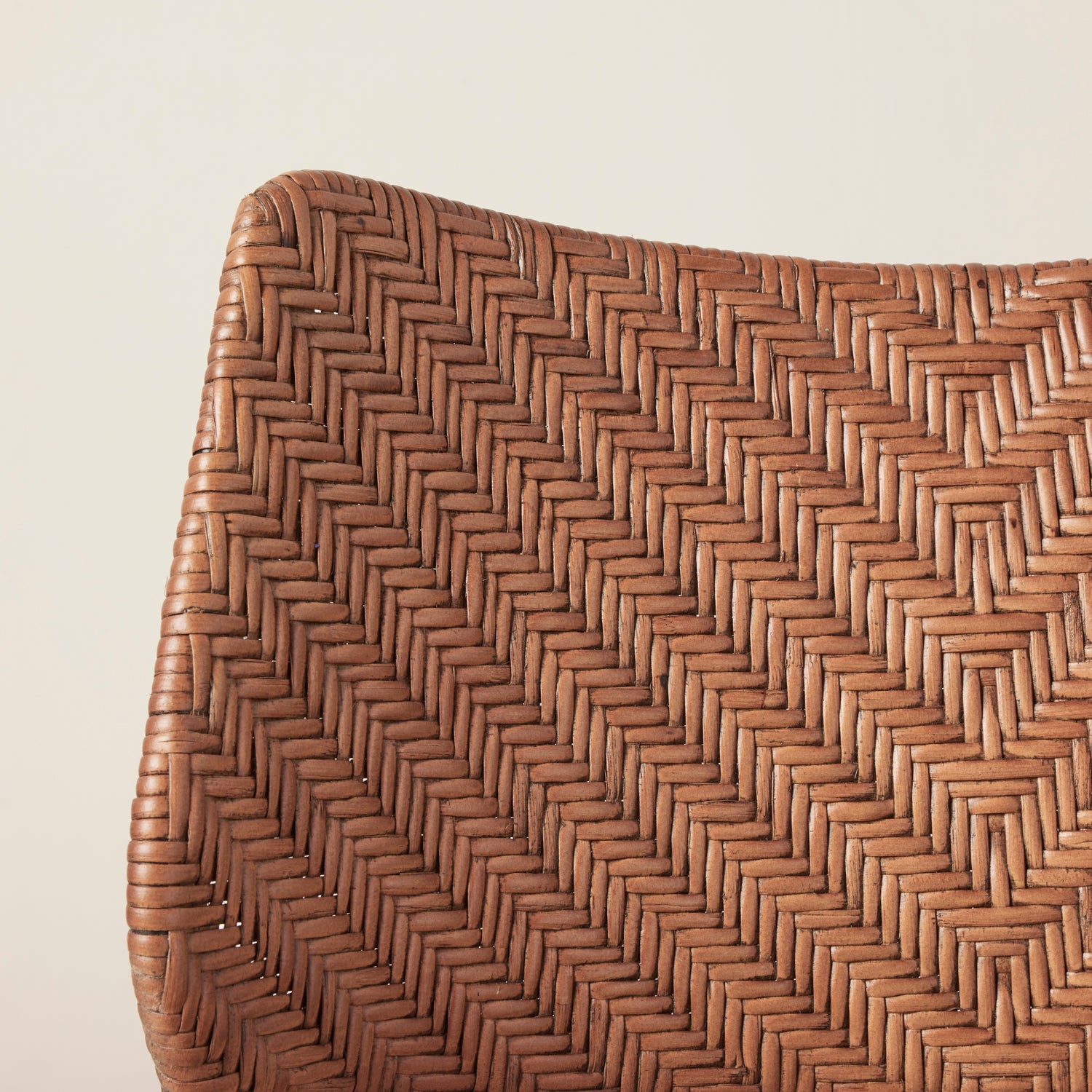 Close-up of a woven brown basket on a light beige background- Number 5