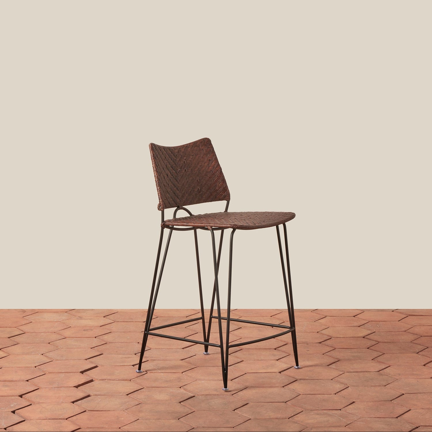 Brown bar stool with metal legs on a wooden floor and beige wall background- Number 7