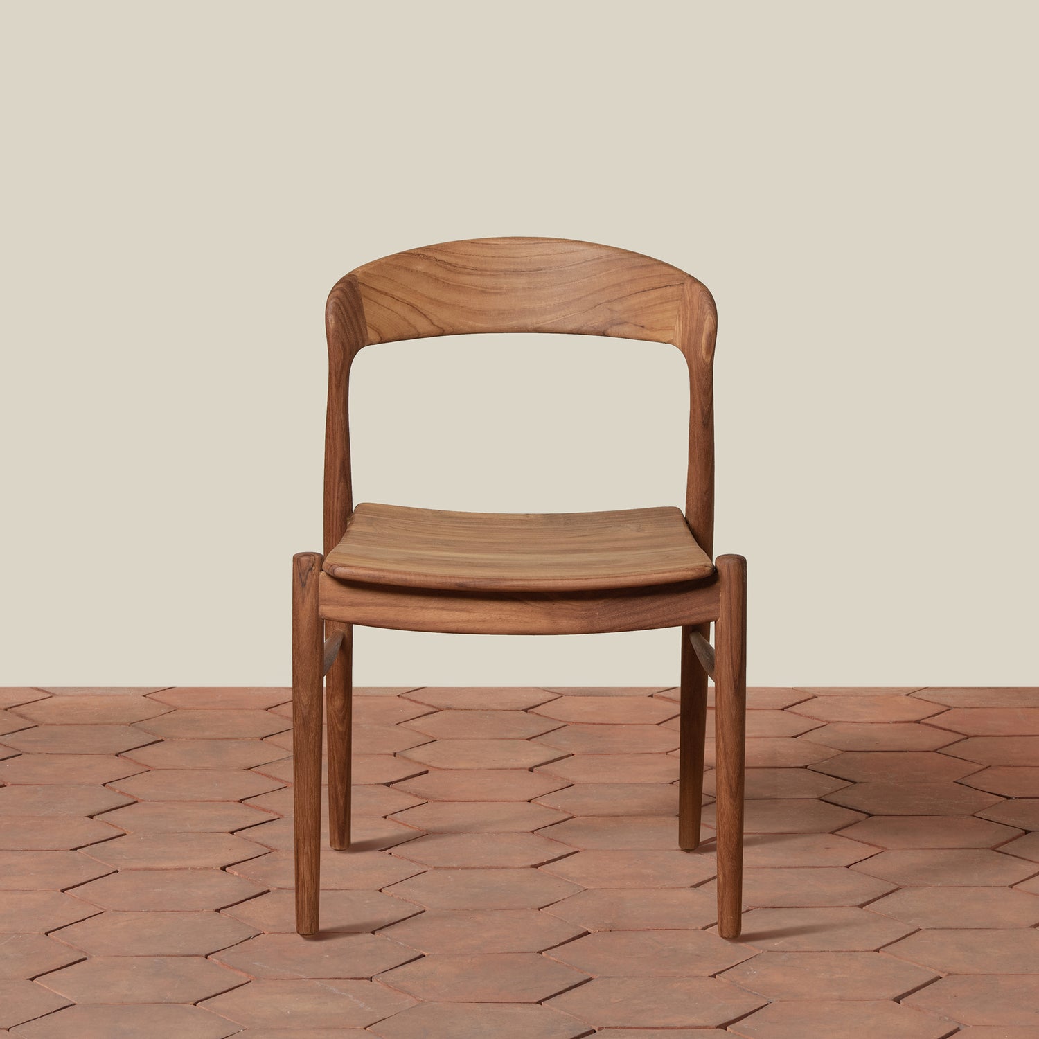 Wooden chair on a textured floor with a neutral background- Number 3