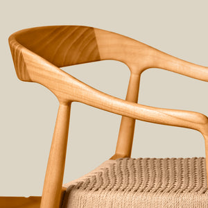 Wooden chair with woven seat on a beige background - Number 20