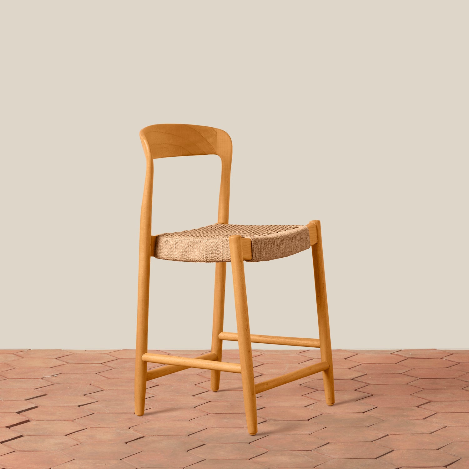 Wooden bar stool with woven seat on a wooden floor and beige wall background- Number 1