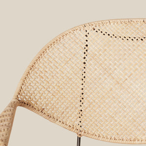 close up of white rattan woven chair back against neutral background - Number 13