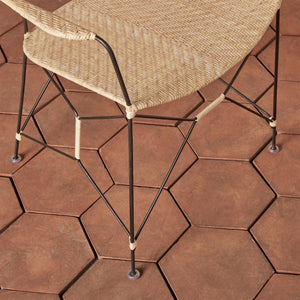 closeup of white and black chair seat and legs on tiled floor - Number 12