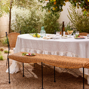 Outdoor dining setup with a table, chairs, and a bench under a lemon tree. - Number 2