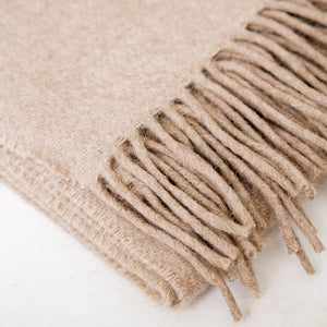 Beige blanket with fringes on a white background - Number 3