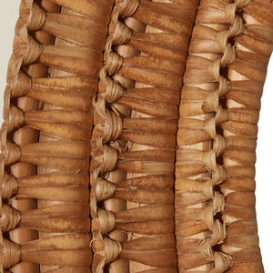 Close up of a round mirror with a woven wicker brown frame - Number 6