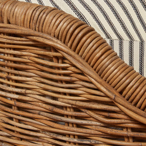 Close-up of a wicker basket with a striped fabric background - Number 20