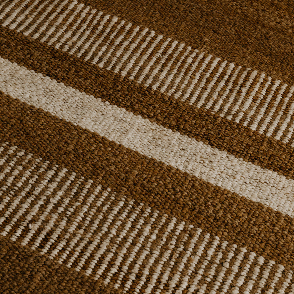Close-up of a brown and beige striped rug- Number 4