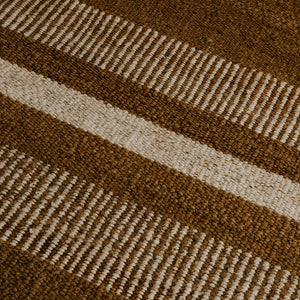 Close-up of a brown and beige striped rug - Number 4