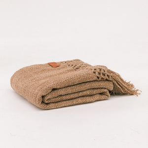 Folded beige blanket on a white background - Number 4