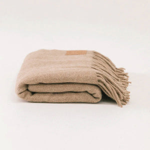Folded beige blanket on a white background - Number 1