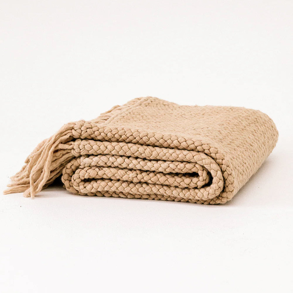 Beige knitted blanket on a white background- Number 1