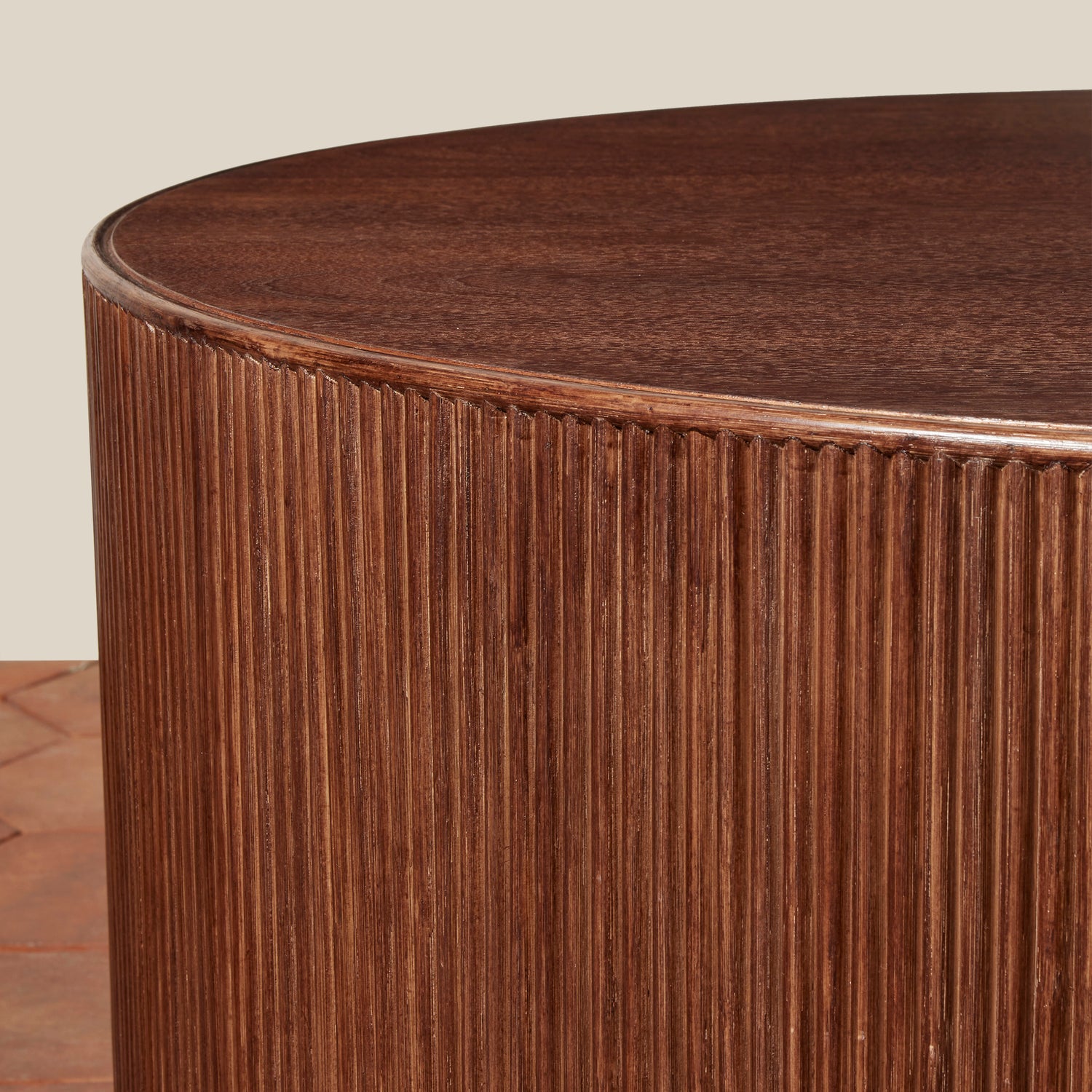 Round wooden table with ribbed texture on a neutral background- Number 6