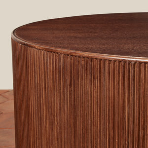 Round wooden table with ribbed texture on a neutral background - Number 6