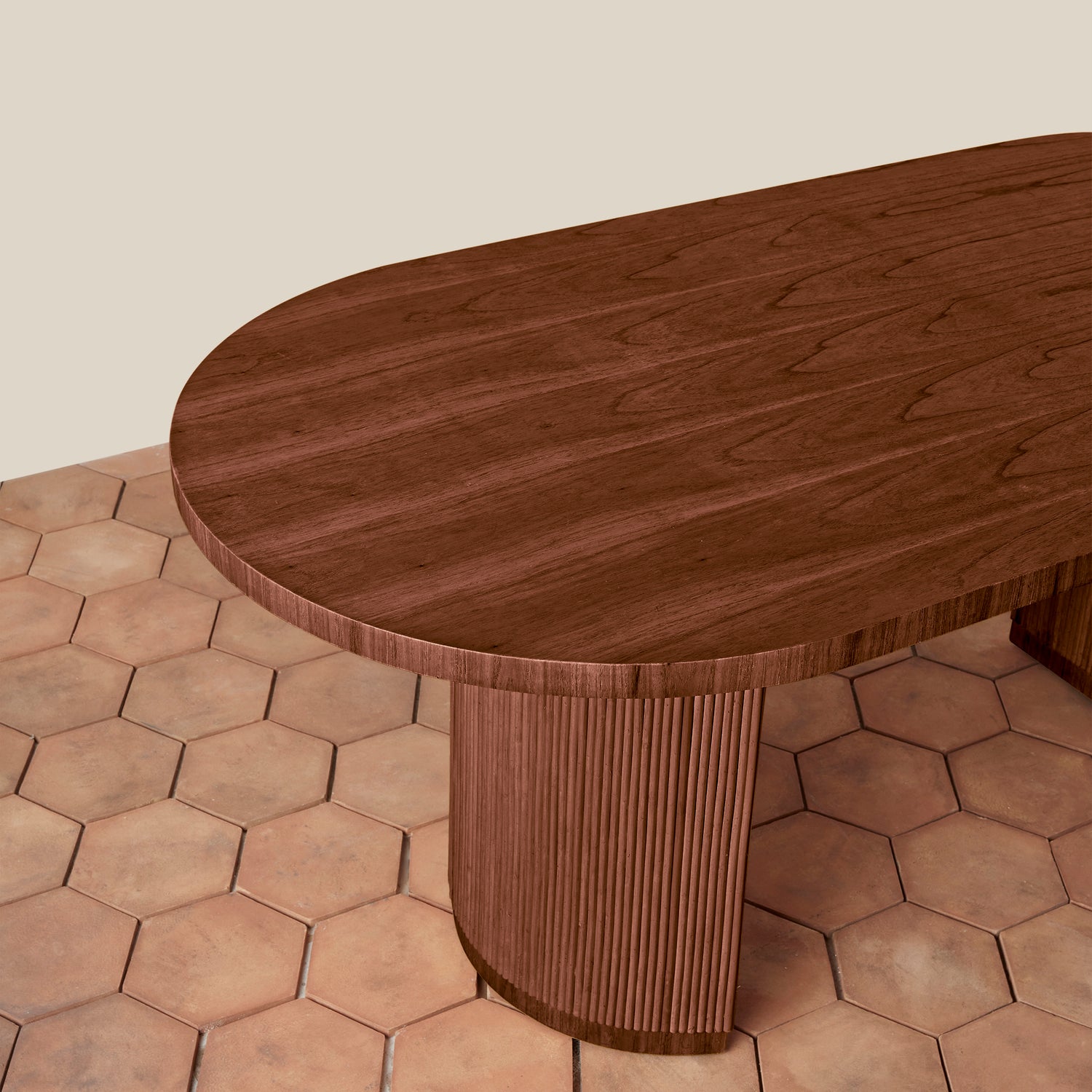 Wooden table with a textured surface on a hexagonal tiled floor.- Number 2