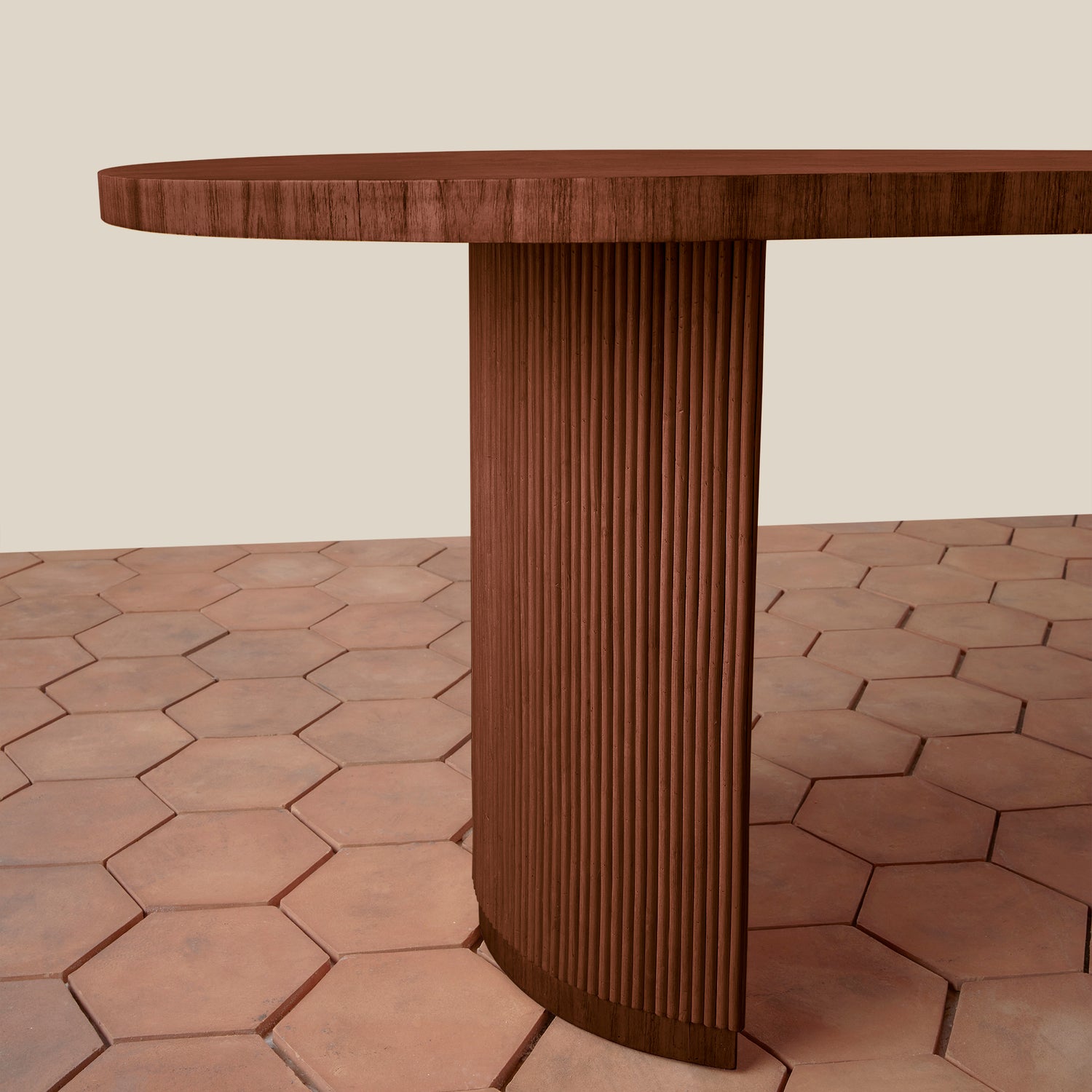 Wooden table with a textured surface on a hexagonal tile floor.- Number 4